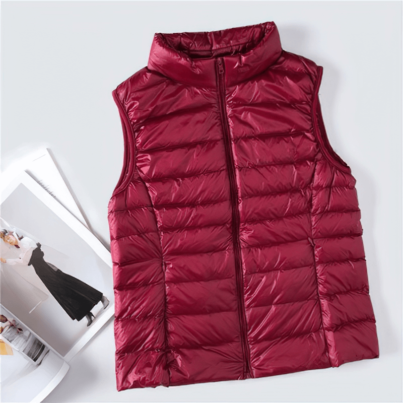 Women's red duck down vest, windproof and lightweight, with waterproof zipper and pockets, perfect for stylish warmth.
