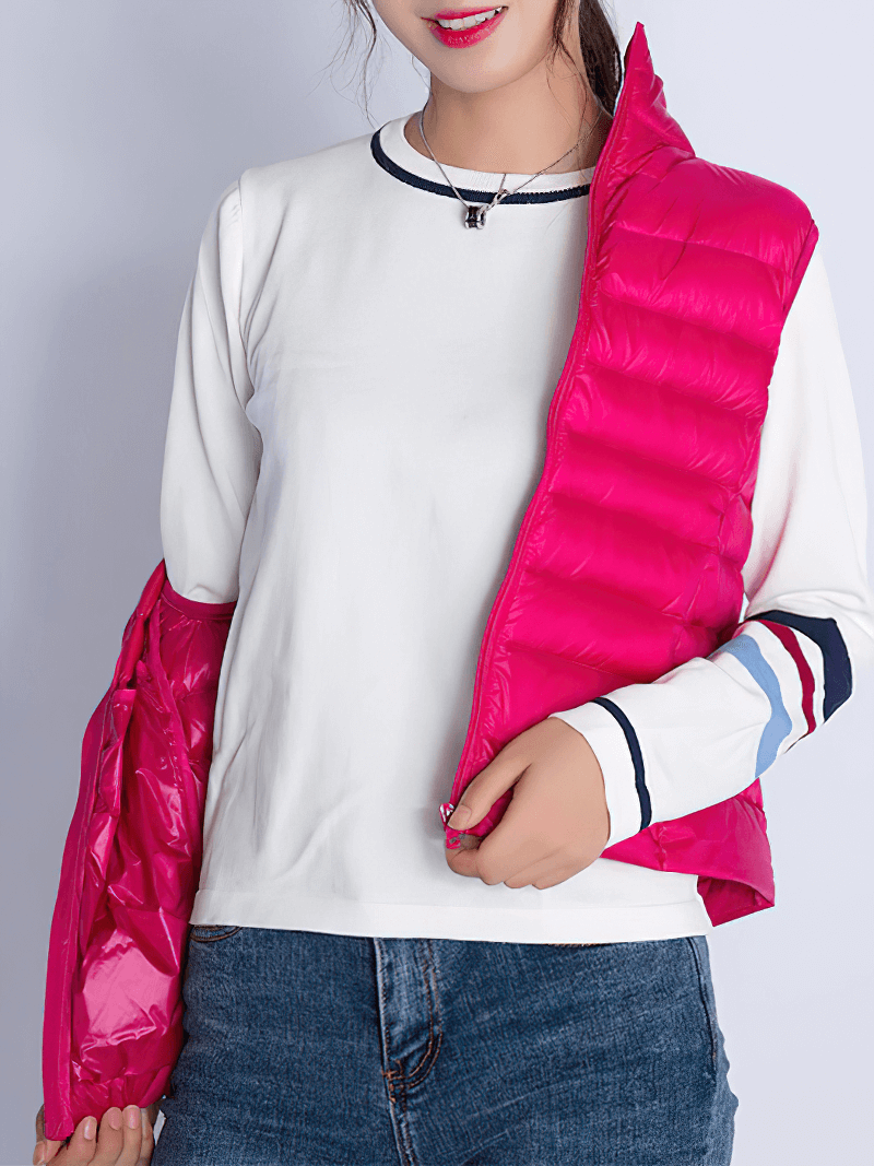Woman wearing a vibrant pink women's zipper windproof duck down vest with pockets, showcasing style and comfort.