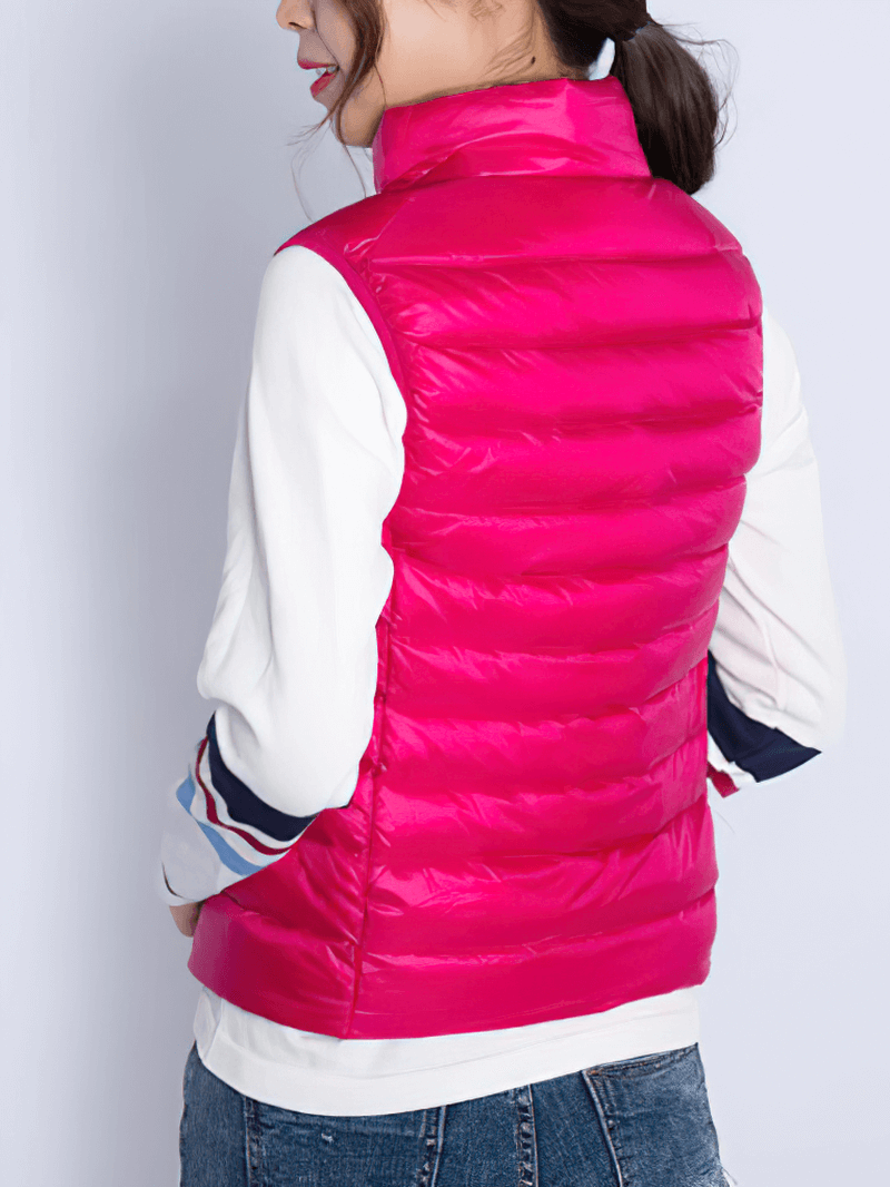 Stylish pink women's windproof duck down vest with waterproof zipper and pockets, perfect for chilly days.