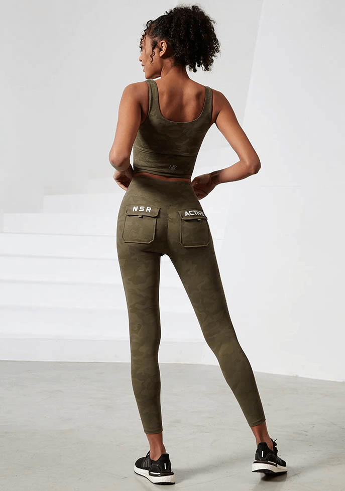 Woman wearing Workout Camouflage High Waist Seamless Leggings with Pockets, showcasing activewear for yoga, running, and dancing.