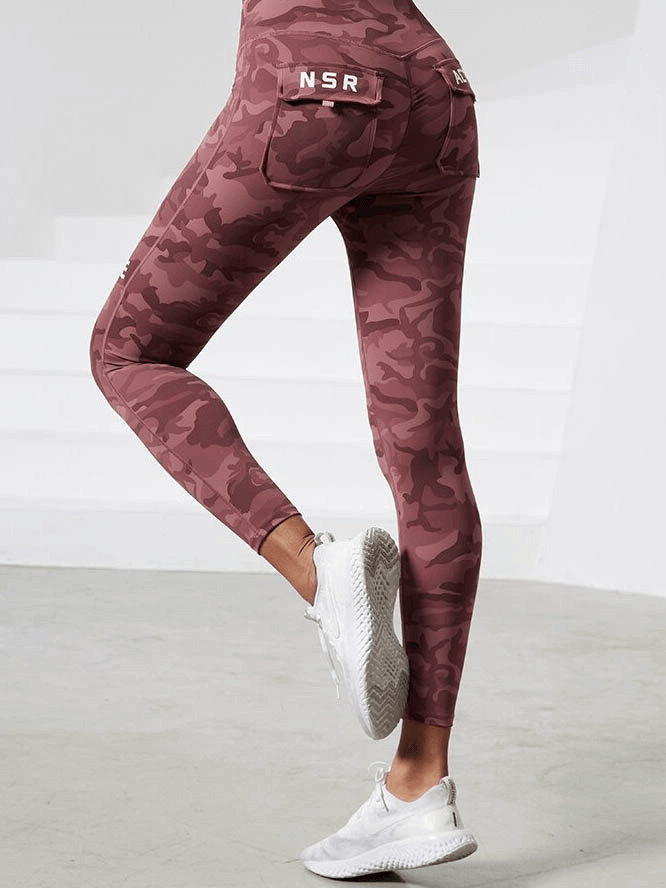 Woman wearing Workout Camouflage High Waist Seamless Leggings with Pockets, designed for yoga, running, and dancing.