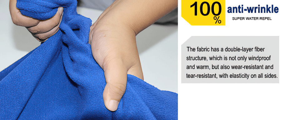 Hands squeezing blue fleece fabric, demonstrating its windproof, wear-resistant, and elastic qualities with anti-wrinkle technology.